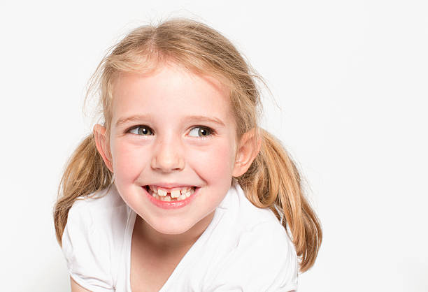 Happy Young Girl with Cheeky Smile stock photo