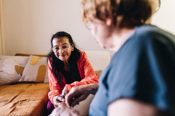 istock Senior friends crocheting at home 1601470592