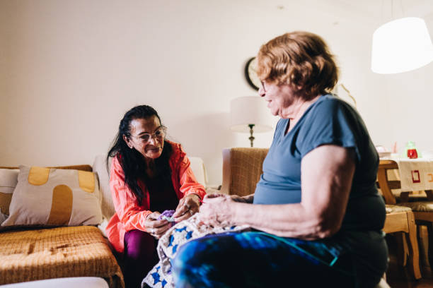 istock Senior friends crocheting at home 1601470598