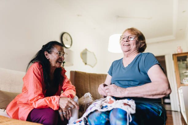 istock Senior friends having fun and crocheting at home 1601473414