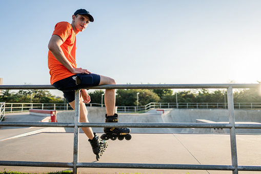 Portrait of a young man using rollerblade at the park
