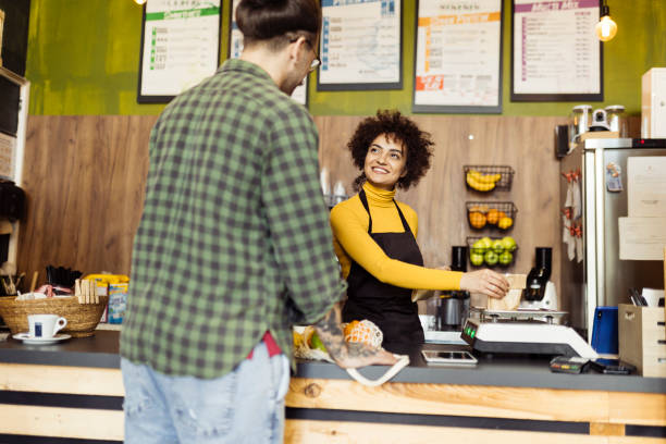istock Man shopping grocery in the small store 1601519110
