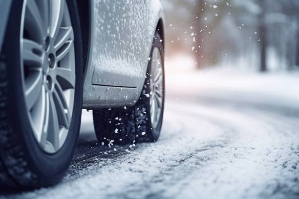 istock Car on winter tires drives through a snow-covered road. 1601523582