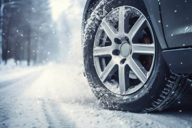 istock Car on winter tires drives through a snow-covered road. 1601523598