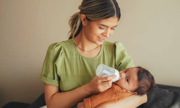 istock Mother bottle-feeding her newborn baby boy 1601533862