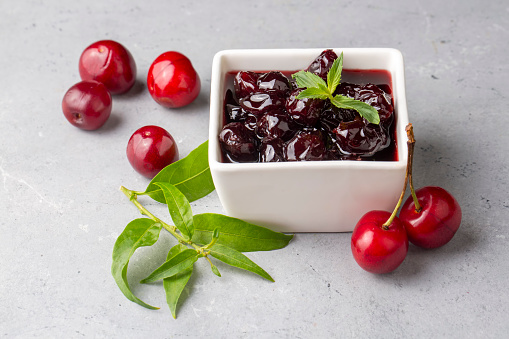 Jars with freshly homemade cherry jam, sour cherry jam, Turkish name; Visne receli