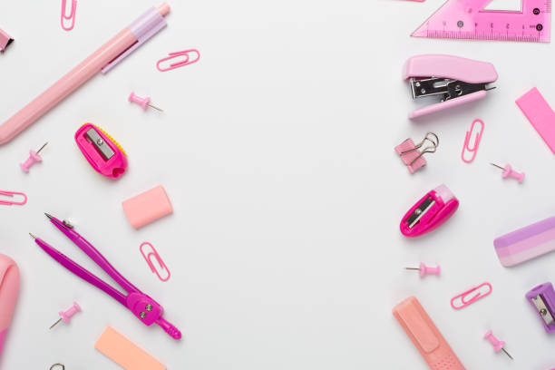istock Pink school stationery on color backgroung, top view 1601577229