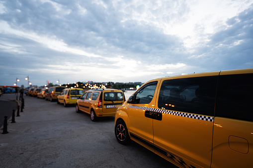 Taxi in the city. Yellow taxis in the city at sunset Nessebar, Bulgaria.