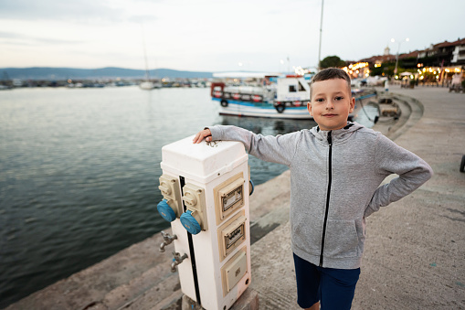 Little boy in the port of Nessebar, Bulgaria