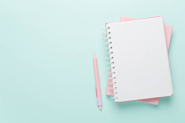 istock Notebooks with stationery on color background, top view 1601622452