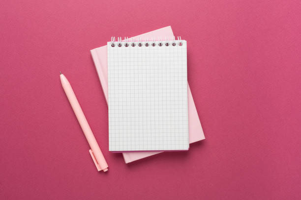 istock Notebooks with stationery on color background, top view 1601622455