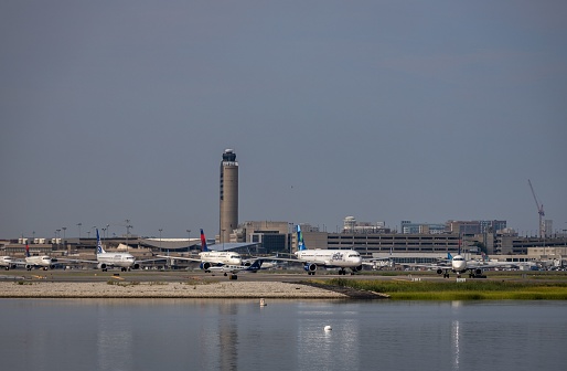 boston, United States – July 29, 2023: the Cape Air, Jetblue and Delta Airlines planes lining up before departure on a busy morning at Boston's Logan Airport