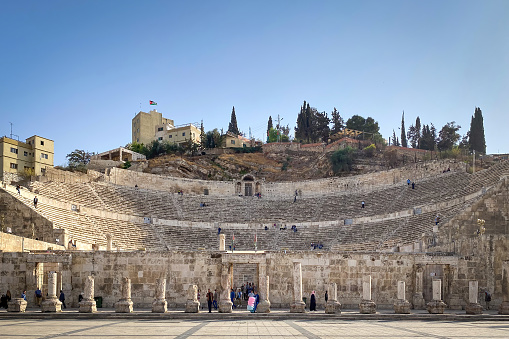 Amman, Jordan - November 1, 2021:  Low angle view of Roman Amphitheater against blue sky