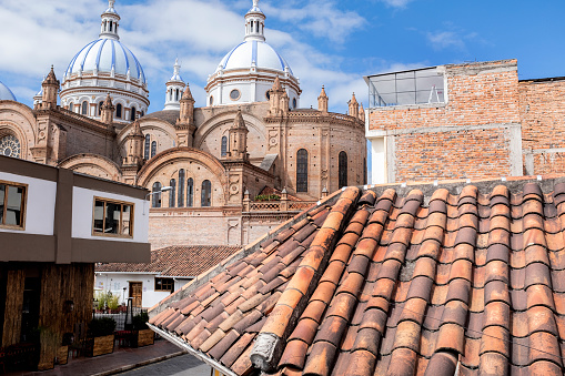 Looking over tiled roofs at the domes of the Cathedral of Immaculate Conception, also known as the \