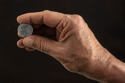 Colombian coins in the palm of the hand