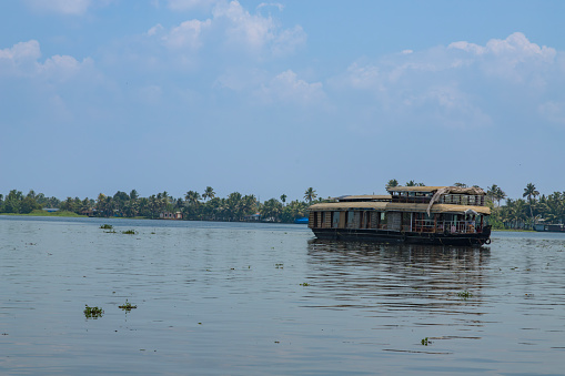 House boat under blue sky from Alleppey or AlappuzhaKerala.Kerala Backwaters, houseboat Photo