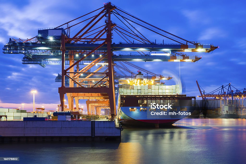 Container in motion I LOVE HAMBURG: Late evening view to the container Terminal Waltershof - Hamburg - Germany - Taken with Canon 5Dmk3 - Canon EF24-70mm f/2.8L IS II USM Travel Stock Photo