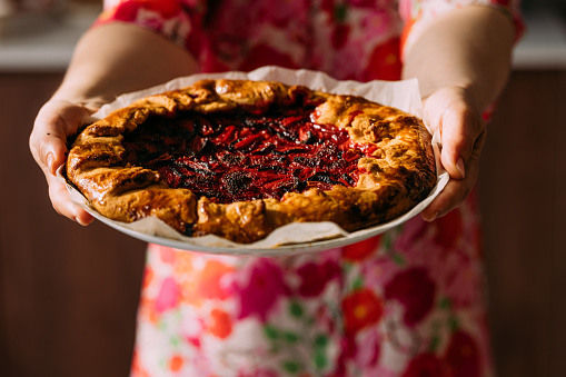 istock An Unrecognizable Woman Holding A Beautiful Homemade Vegan Pie 1601788512