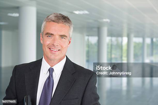 Mature Businessman In Suit Smiling Stock Photo - Download Image Now - CEO, Men, Necktie