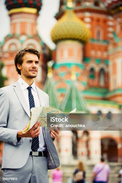 Handsome Young Businessman In Moscow Holding Street Map Stock Photo - Download Image Now