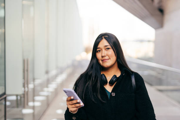 istock Smiling woman in financial district 1601801841