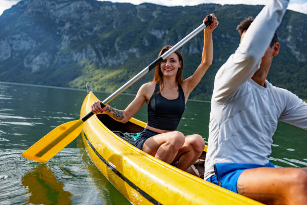 istock Couple Canoeing Together On A Lake 1601817401