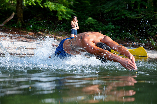 Man Swimming In A Lake