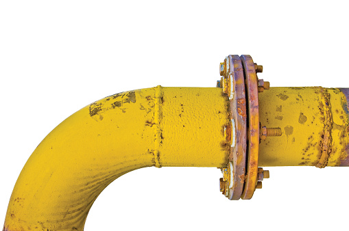 Old aged weathered grunge gas pipe connection flange joints, isolated horizontal yellow pipeline curve, large detailed closeup, white background