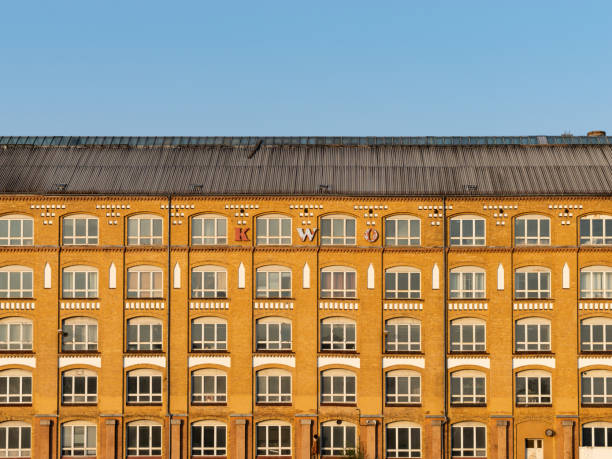 Former Kabelwerk Oberspree (KWO) facade of the industrial building in Berlin. The manufacturing hall was part of the production of electric cables. The exterior is weathered but under historic preservation.