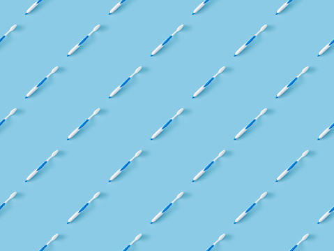 Seamless repetitive Toothbrush on blue background