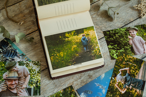 Photo printing concept. Printed photos in family picture album.
