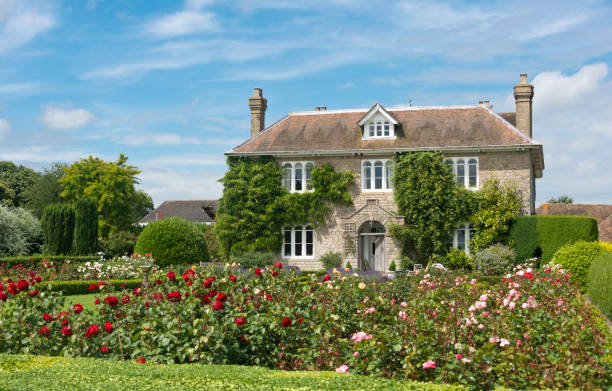 English Country Cottage A Picturesque English country cottage with rose garden, located in an English Village. english cottage stock pictures, royalty-free photos & images