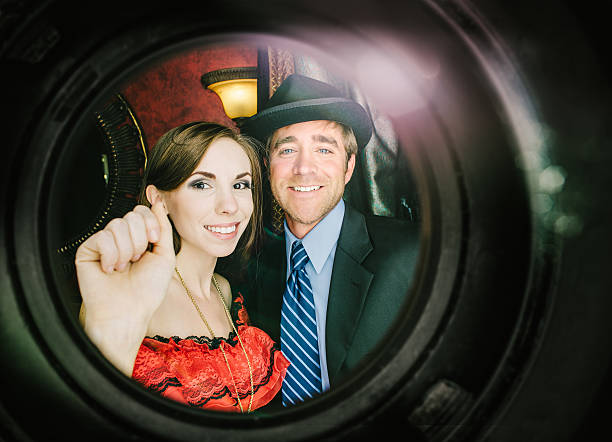 Friends knocking Dressed up couple knocking at their friends door. peep hole stock pictures, royalty-free photos & images