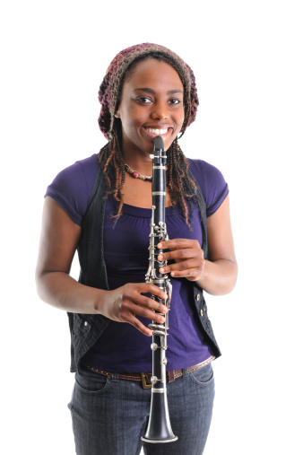 An African American musician playing the clarinet.  