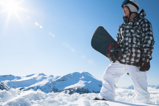 Male snowboarder in the mountain