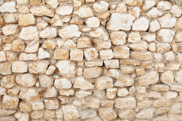 istock grey  brown rugged rock wall background Croatia 160188877