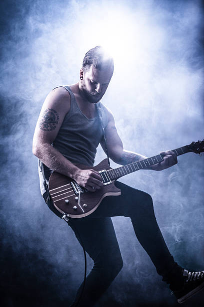 istock Young Guitar Player in Rock Concert 160189241