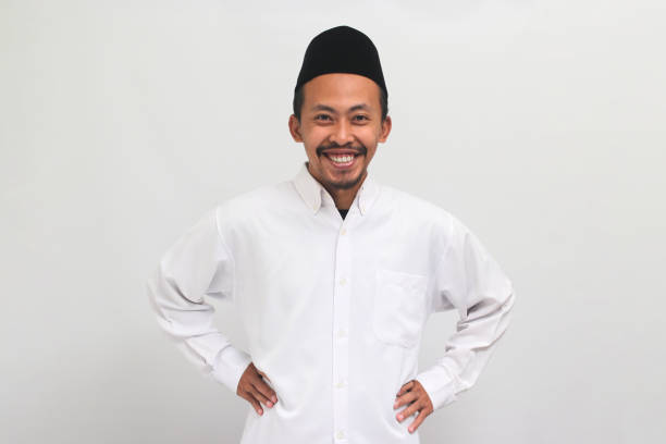 istock Confident young Indonesian man is in an akimbo gesture, isolated on a white background 1601893052