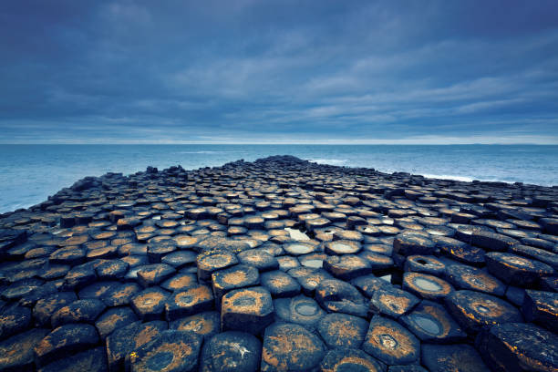 Giant's Causeway on a cloudy day Giant's Causeway on a cloudy day - Northern Ireland giants causeway photos stock pictures, royalty-free photos & images