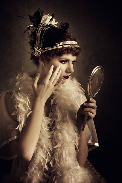istock vintage style woman looking herself in a mirror 160189444