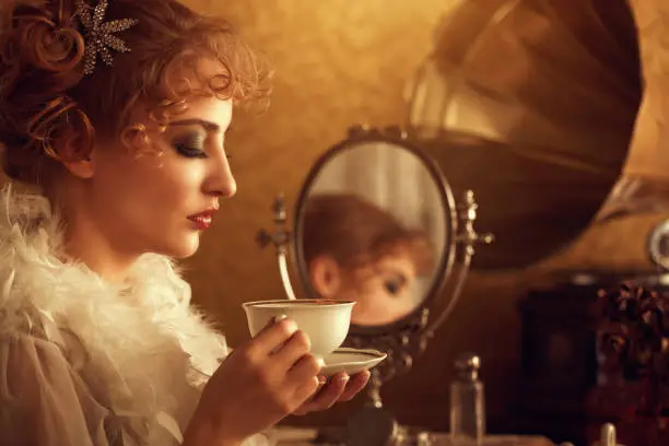 retro beauty drinking coffee in the morning