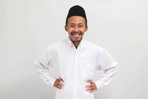 istock Confident young Indonesian man is in an akimbo gesture, isolated on a white background 1601895628