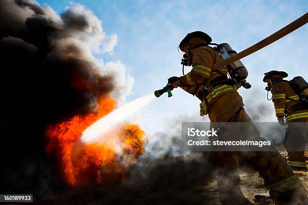 Firefighters Extinguishing House Fire Stock Photo - Download Image Now - Firefighter, Fire - Natural Phenomenon, Fire Station