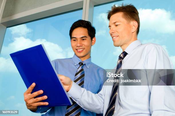 Business Men Sharing Information Stock Photo - Download Image Now - Document, Adult, Adults Only