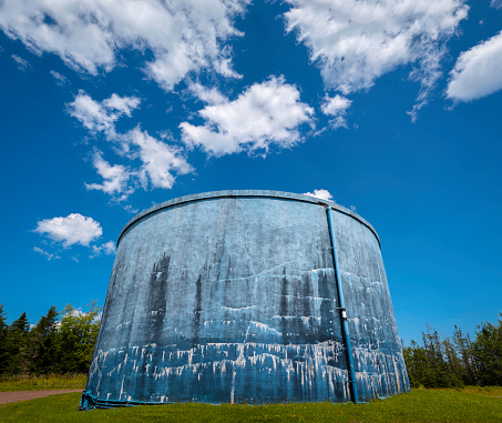 Rustic blue water tank with abstract textures of weathered paint at Town of Truro Reservoir at Victoria Park in Truro, Nova Scotia, Canada