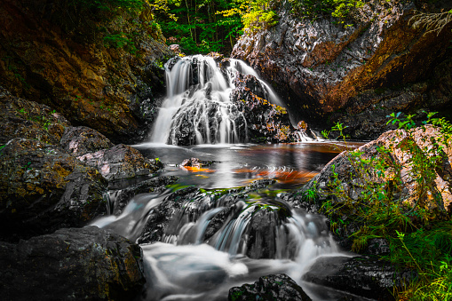 Chutes Waber Waterfalls in summer located in Parc national de la Mauricie, Quebec, Canada. At 27 metres in height, the falls have a water flow that varies with the seasons, offering spectacular panoramas.