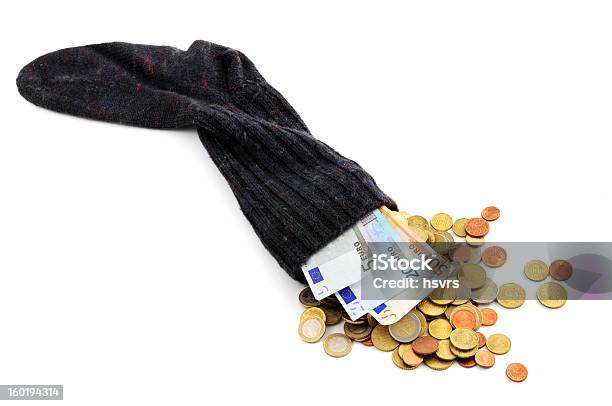 Euro Coin And Paper Currency Falling Out Of Money Sock Stock Photo - Download Image Now