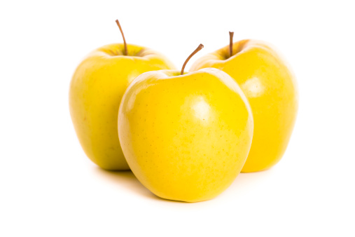 delicious yellow apples on white background