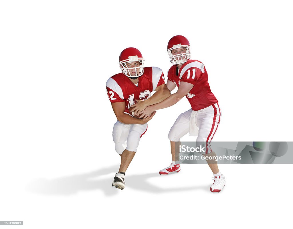 Football Handoff with Clipping Path Quarterback handing off the ball to a running back. American Football - Sport Stock Photo