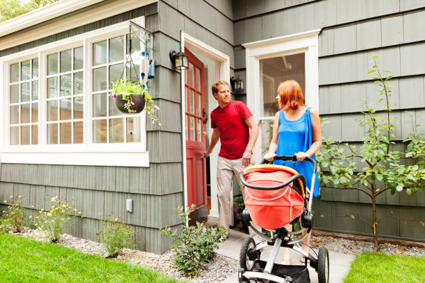 istock Young Family Leaving Home with Baby Stroller 160195942